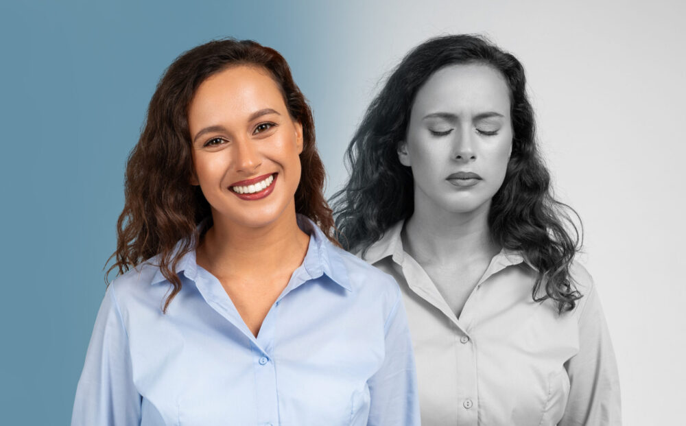 A young woman stands confidently with a bright smile while her expression is juxtaposed with a monochrome representation of sadness behind her. The complexities of human feelings.